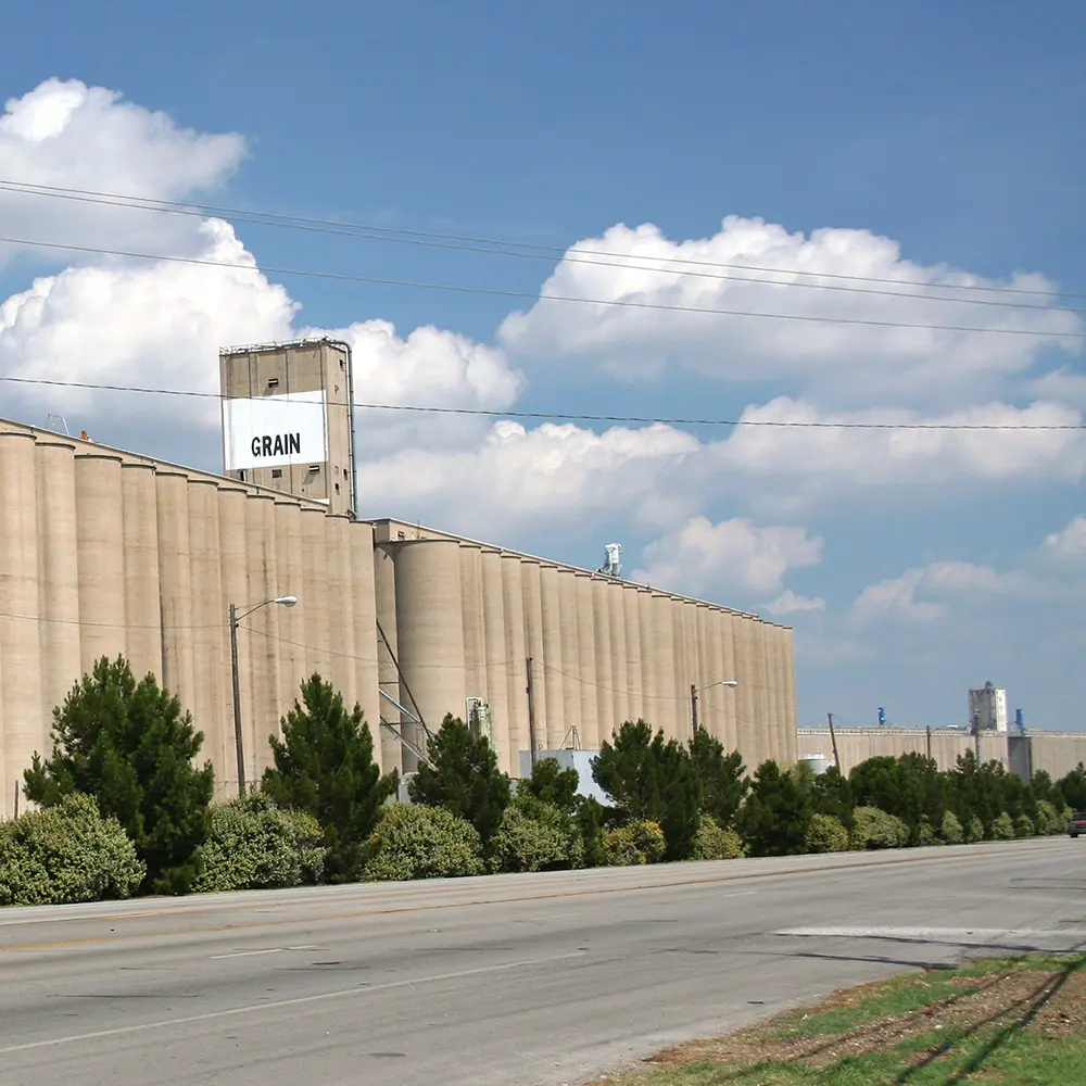 a large grain silo alongside Saginaw Main Street in Saginaw, Texas